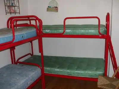 a bedroom with two bunk beds in a room at Bellamonte Mar in Bellamonte