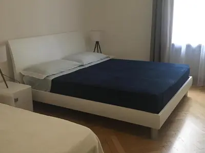 a bedroom with a bed with a blue mattress at Appartamento Nadia in Merano