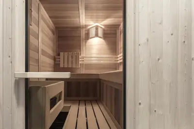 a sauna with wooden walls and a wooden floor at Artefugium Atelier in Selva di Val Gardena