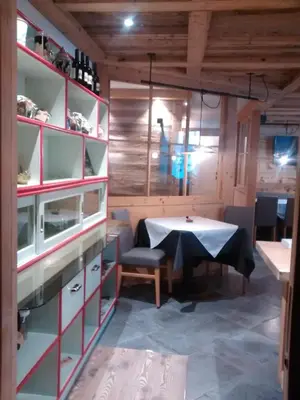 a dining room with a table and a table and chairs at Agriroom in Rumo
