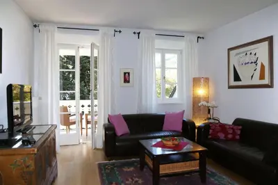 a living room with a couch and a table at Villa Lageder in Sarntal