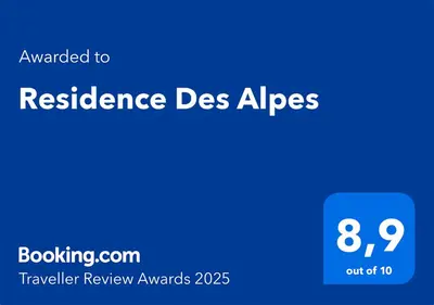 a blue rectangle with the words resilience des aisges on it at Residence Des Alpes in Canazei