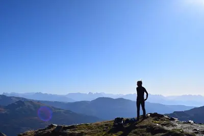 a person standing on the top of a mountain at Gasthof Rabenstein in Sarntal