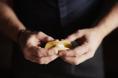 a person holding an apple in their hands at Diana Dolomites in La Villa