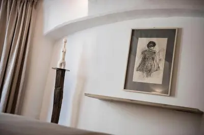 a picture of a woman on a shelf in a bedroom at Apartment Valentina in Bressanone