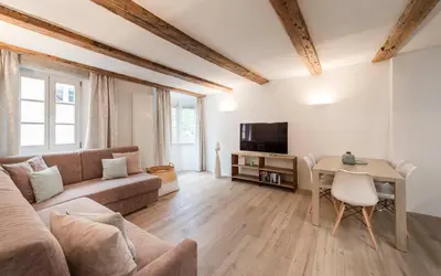 a living room with a couch and a table at Apartment Valentina in Bressanone
