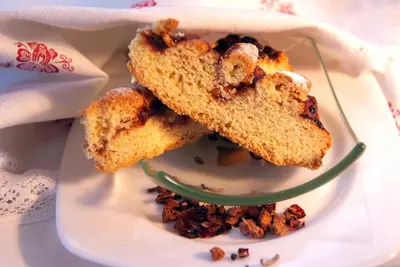 a plate with three pieces of bread on aucer at Agritur Darial in Tesero