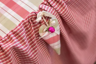 a pink dress shirt with a pink bow on it at Boutique Hotel Olympia in San Vigilio Di Marebbe