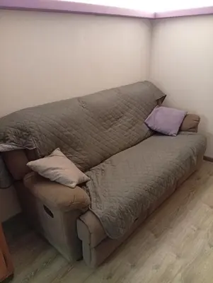 a bed in a room with two pillows on it at Casa Litegosa in Panchia