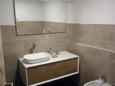 a bathroom with a sink and a mirror at Casa Litegosa in Panchia