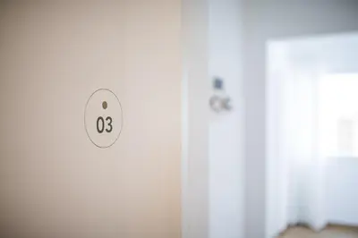 a room with a door with the number eight at Villa am Gries in Lana