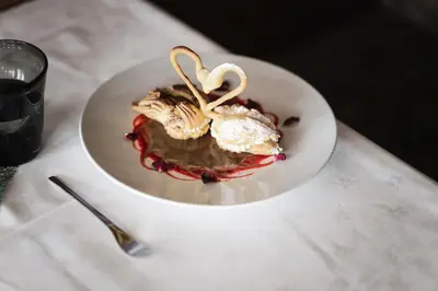 a white plate of food on a table at Hotel Pider in La Valle