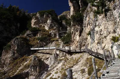 a staircase on the side of a mountain at Hotel Piné in Tires