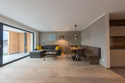 a living room with a couch and a table at Moar am Ort in Schenna