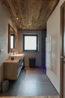 a bathroom with a sink and a large window at Moar am Ort in Schenna