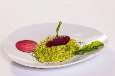 a plate of food with a strawberry on top at Hotel Jägerhof in San Leonardo in Passiria
