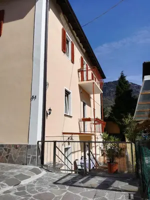 a building with a balcony in front of it at Villa Wally in Merano