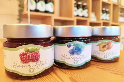 three jars of jam sitting on top of a table at Thalhofer Hof in Lazfons