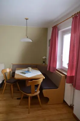 a room with a table and chairs and a window at Haus Hofer in Barbiano