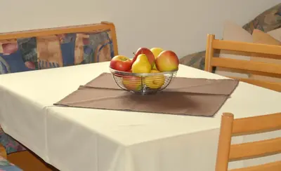 a bowl of apples on a table with a table cloth at Haus Hofer in Barbiano