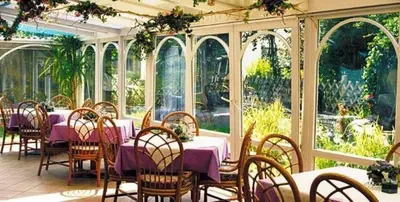 a dining room with a purple table and chairs at Residence Priska in Racines