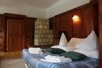 a hotel room with a bed with towels on it at Residenze Sonnenschein in Villabassa