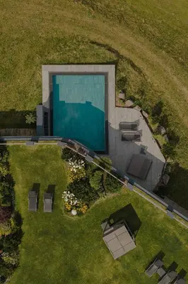 an overhead view of a backyard with a swimming pool at Rainell Dolomites Retreat in Ortisei