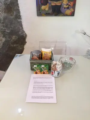 a table with a box of food and a bowl of vegetables at Casa di Micky in Canale San Bovo
