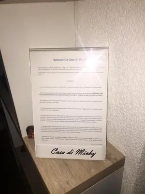 a piece of paper sitting on top of a shelf at Casa di Micky in Canale San Bovo