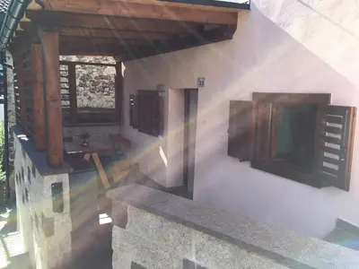 a building with a sink and a window on the wall at Casa di Micky in Canale San Bovo