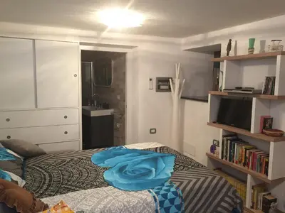 a bedroom with a bed with a blue towel on it at Casa di Micky in Canale San Bovo