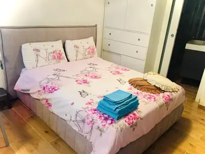 a bedroom with a bed with flowers on it at Casa di Micky in Canale San Bovo