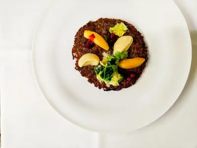 a white plate with some food on it at Hotel Kassian in Lagundo