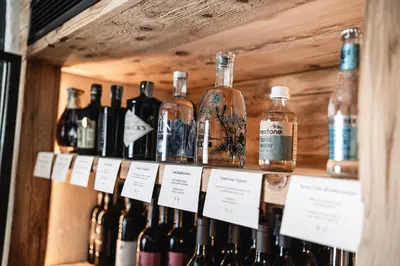 a dining room with a wooden table and chairs at Hotel Kassian in Lagundo