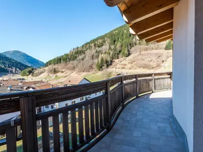 a balcony with a view of a mountain at Bio Hotel Brusago Vital & Wellness in Bedollo