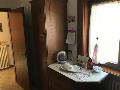 a kitchen with a counter with a telephone on it at Affittacamere Iragidor in Cortina dʼAmpezzo