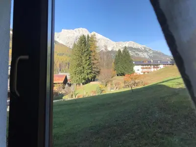 a view of a mountain from a window at Affittacamere Iragidor in Cortina dʼAmpezzo