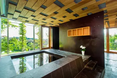 an indoor pool in a kitchen with a large window at Hotel Goldener Stern in Caldaro