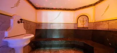 a bathroom with a toilet and a sink at Turmchalet Adults Only in Braies