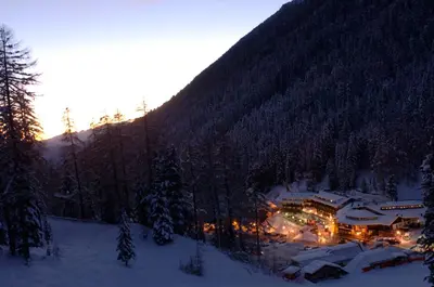 a ski lodge in the middle of a snow covered mountain at Sport Hotel Pampeago in Tesero