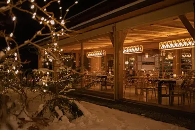 a restaurant with christmas lights and tables and chairs at Kircherhof in Bressanone