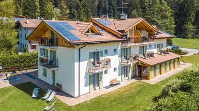 an aerial view of a house with solar panels on its roof at Affittacamere Villa Belfiore in Ronzone