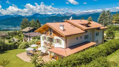 an aerial view of a house with a roof at Affittacamere Villa Belfiore in Ronzone