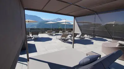 a view of a patio with chairs and tables and umbrellas at Hotel Andechserhof & Mountain Sky in Laion