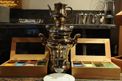 a trophy sitting on a table next to two boxes at Hotel FleurAlp in Cermes