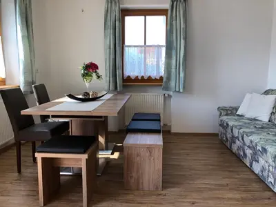 a living room with a table and a couch at Rofenhof in Naturno