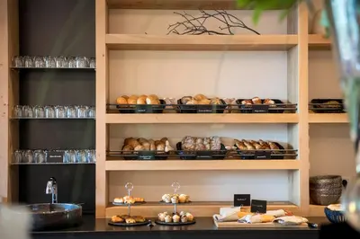 a shelf filled with lots of different types of bread at Das Grafenstein Familienresidence in Cermes