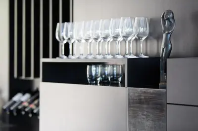 a row of wine glasses sitting on a counter at Villa Weingarten in Caldaro