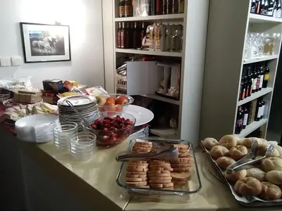 a table with a bunch of food on it at B&B Hotel Dolomiti in Bolzano
