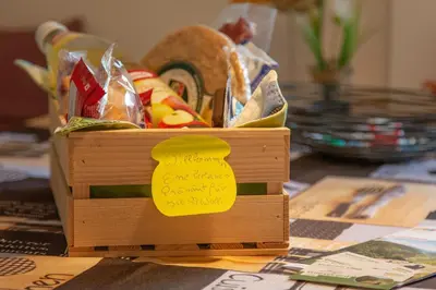 a wooden crate filled with food on a table at Apartment Haus Lang in Lagundo